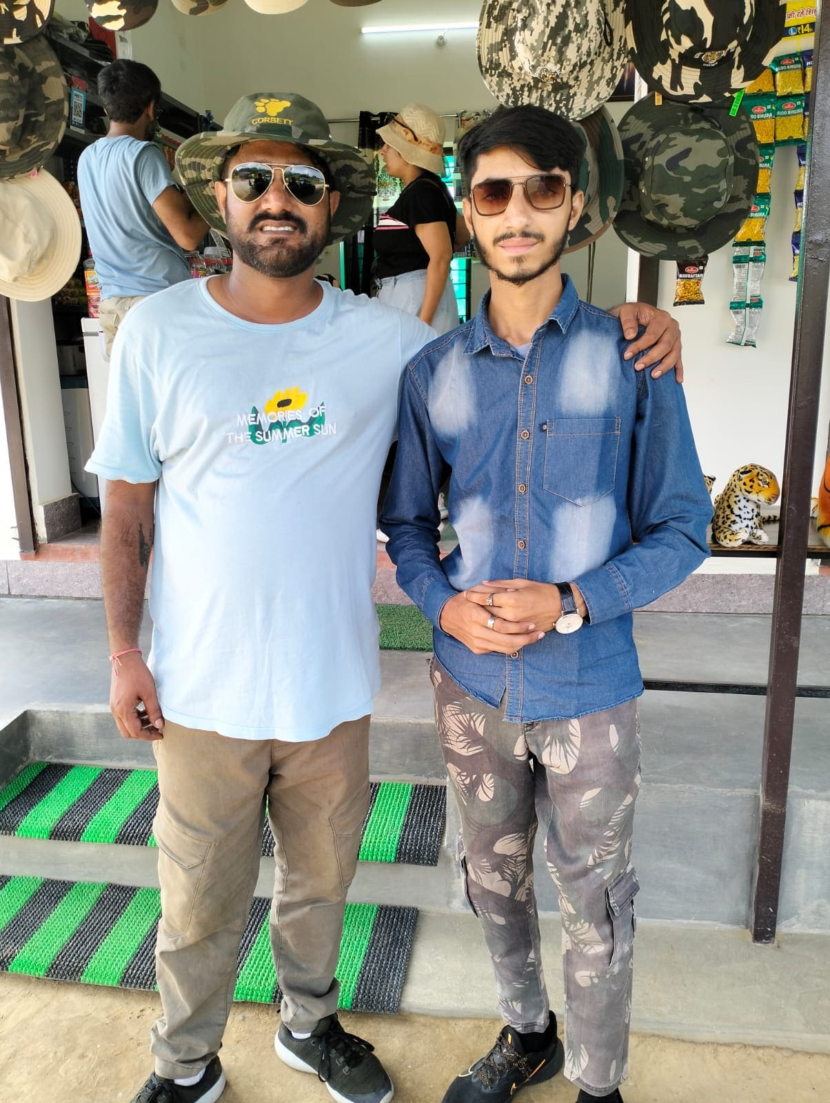 Two visitors at a Corbett souvenir shop